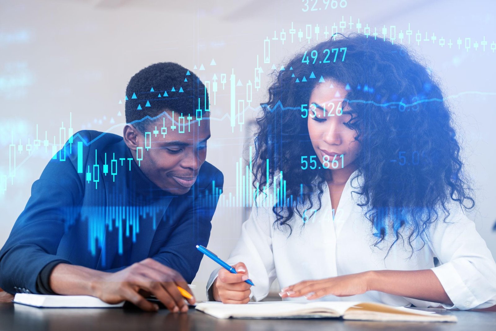 Young African entrepreneur studying forex trading charts on laptop for financial education